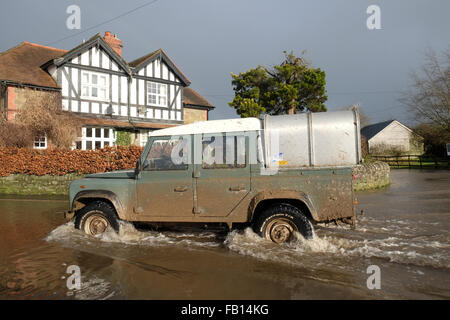 Combe, Herefordshire, UK. 7th January, 2016. A farmers Land Rover negotiates the flooded B4362 at Combe on the rural England-Wales border that links Presteigne, Powys with Shobdon, Herefordshire. Stock Photo