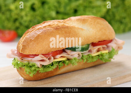 Sub deli sandwich baguette with ham, cheese, tomatoes and lettuce Stock Photo