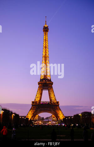 Eiffel Tower at Sunset in Paris, France just after the lights come on.