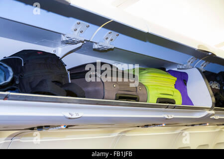 Overhead passenger locker / lockers / compartment / compartments for stowing passengers bags cabin luggage on an Airbus aircraft Stock Photo