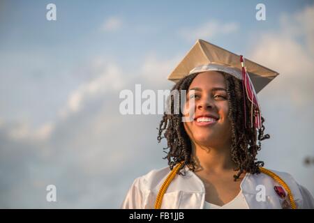 Portrait of happy teenage girl at graduation ceremony Stock Photo