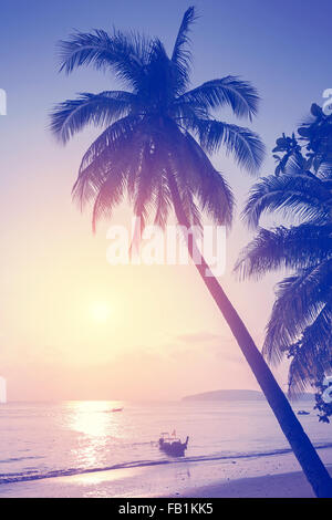 Vintage toned tropical beach at sunset. Stock Photo