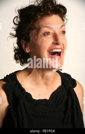 An adult woman imitates the expressions of a baby. Stock Photo