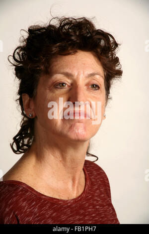 An adult woman imitates the expressions of a baby. Stock Photo