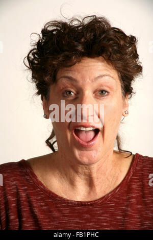 An adult woman imitates the expressions of a baby. Stock Photo