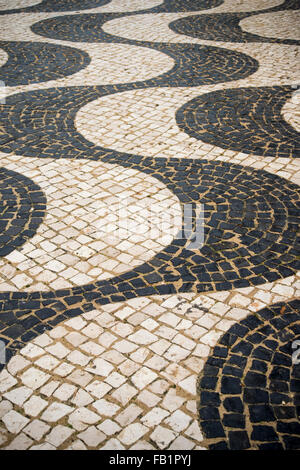 mosaic patterned tiles in Praia da Luz in western Algarve, Portugal Stock Photo