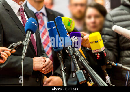 Microphones of different TV and radio stations during a press conference, media, Stock Photo