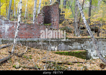 Remnants of the powerhouse in the abandoned village of Livermore, New Hampshire during the autumn months. This was a logging village. Stock Photo