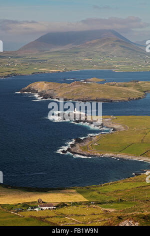 view from Geokaun Mountain on Valentia Island to Doulus Bay with the Lighthouse, Beginish Island and Knocknadobar Mountain Stock Photo