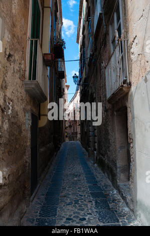 Narrow street between italian houses in old town of Tropea Stock Photo