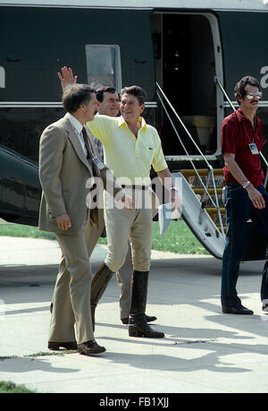 Washington, DC., USA,  July 1981 President Ronald Reagan waves as he walks off Marine One after returning to Washington from Camp David where he and Vice-President George H.W. Bush where riding horses. Marine One landed at the alternate landing zone at the Rainbow Fountain on the monunent grounds Credit: Mark Reinstein Stock Photo