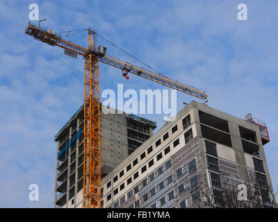 A high crane on a construction site Stock Photo