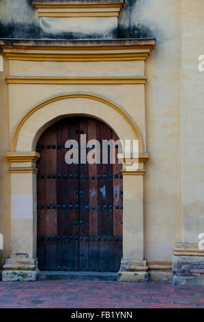 Entrance of old colonial building with wood door Stock Photo