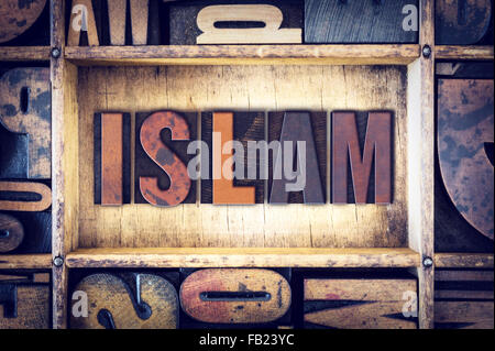 The word 'Islam' written in vintage wooden letterpress type. Stock Photo
