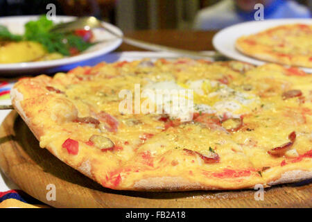 pizza tasty and appetizing on the wooden board Stock Photo