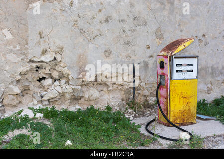 Distributor or gas pump, abandoned. Isolated, old and rusty in a war zone, a symbol of power, the concept of abandonment. Abstra Stock Photo