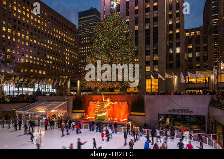 Lower Plaza of Rockefeller Center with ice skating rink and Christmas tree by night, Manhattan, New York, USA Stock Photo