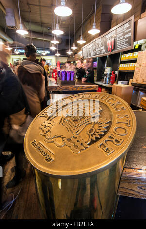 Plaque celebrating the first Starbucks store established in 1971 at Pike Place Market, Seattle, Washington, USA Stock Photo