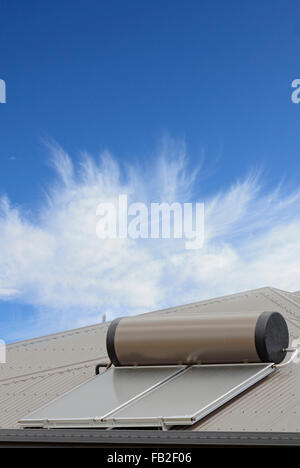 Hot water boiler with solar panel on roof Stock Photo - Alamy