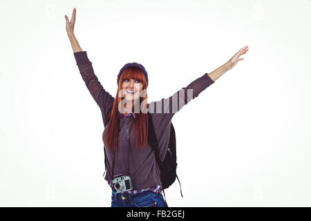 Smiling hipster woman with hands up Stock Photo