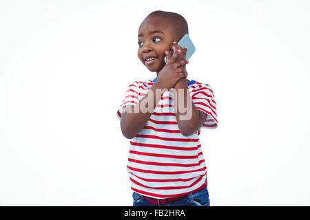 Standing boy on a phone call Stock Photo