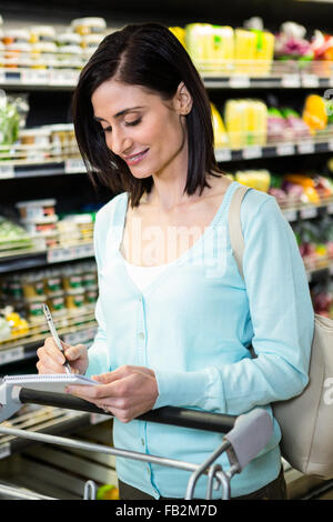 Smiling woman checking list Stock Photo