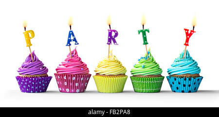 Row of colorful party cupcakes isolated on a white background Stock Photo