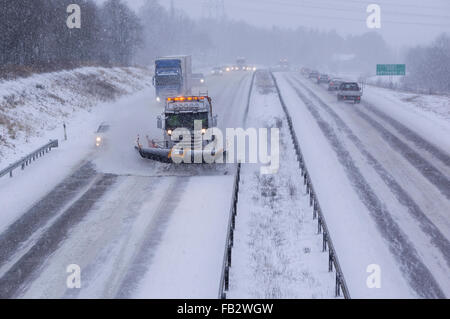 Sweden Weather: E20, Floda, Sweden, 8th Feb 2016. First major snowfall of the year causes traffic accidents and widespread travel disruptions. Snowplows and gritters are deployed to keep E20 motorway open.  Model Release: No.  Property Release: No. Stock Photo