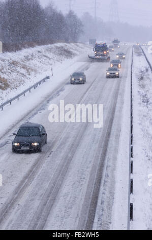 Sweden Weather: E20, Floda, Sweden, 8th Feb 2016. First major snowfall of the year causes traffic accidents and widespread travel disruptions. Snowplows and gritters are deployed to keep E20 motorway open.  Model Release: No.  Property Release: No. Stock Photo