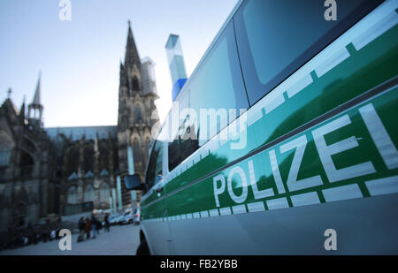 Cologne, Germany. 8th Jan, 2016. A police car parked near the Cologne Cathedral in Cologne, Germany, 8 January 2016. According to police reports, numerous women were sexually harassed and mugged during the New Years Eve celebrations on the square in front of Cologne's central station. PHOTO: OLIVER BERG/dpa/Alamy Live News Stock Photo