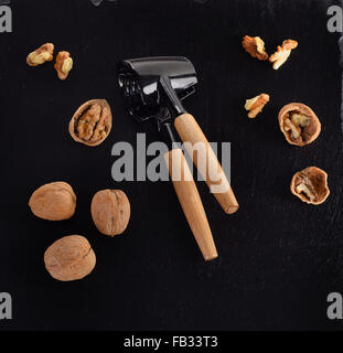 Walnuts on a black table. Top view Stock Photo