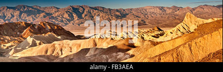 Rock formations at Zabriskie Point, Panamint Range in distance, sunrise, Mojave Desert, Death Valley National Park, California Stock Photo