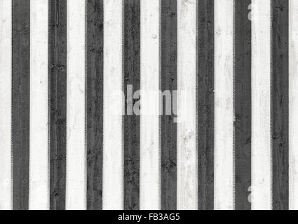 Frozen wooden wall with pattern of black and white stripes. Background photo texture Stock Photo