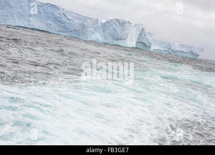 Wake from passenger ship passing by floating sea ice near Shetland Islands in Antarctica. Stock Photo