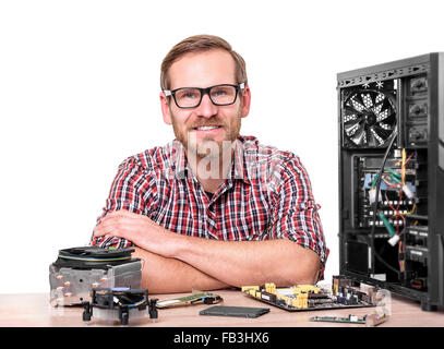 Computer engineer at workplace. Stock Photo
