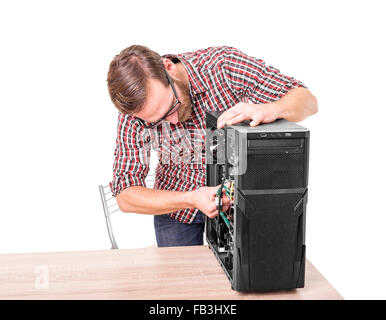 Computer engineer repairs the computer. Stock Photo