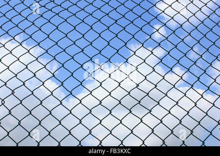 wire fence on sky background during the daytime Stock Photo