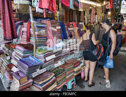 Shopping for Thai silk at Chatuchak Market in Bangkok, Thailand Stock Photo