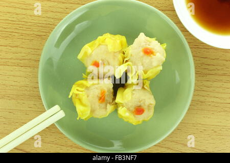 shumai , siu mai - chinese steamed pork dumplings with sauce Stock Photo