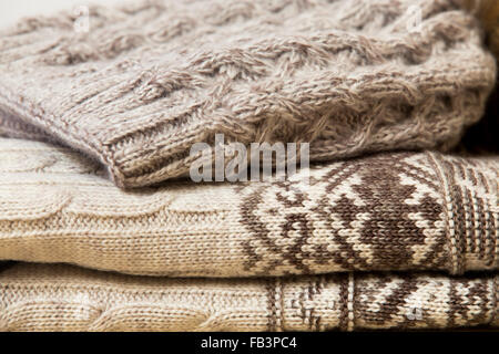 Close up of folded woolen clothes in beige Stock Photo