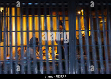 view of people dining in a teahouse through bamboo curtain in Higashi Chaya District, Kanazawa, Ishikawa Prefecture, Japan Stock Photo