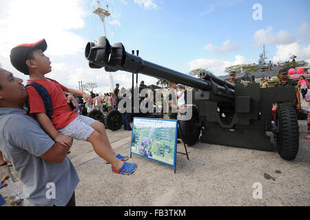 Bangkok, Thailand. 9th Jan, 2016. A child looks at a military vehicle at the Royal Thai Navy Academy in south Bangkok, Thailand, Jan. 9, 2016. The Thai National Children's Day is celebrated on every second Saturday in January. Credit:  Rachen Sageamsak/Xinhua/Alamy Live News Stock Photo