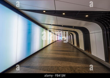 A pedestrian tunnel features an LED integrated lightwall and links St Pancras International and King's Cross St Pancras stations Stock Photo