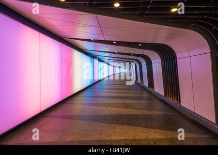 A pedestrian tunnel features an LED integrated lightwall and links St Pancras International and King's Cross St Pancras stations Stock Photo