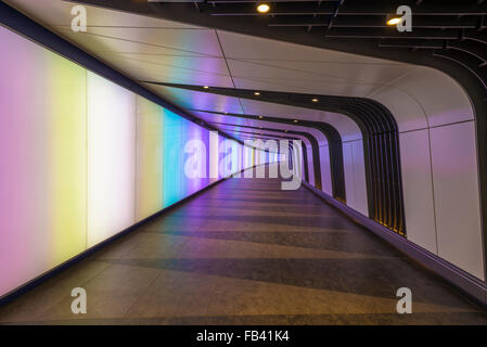 A pedestrian tunnel features an LED integrated lightwall and links St Pancras International and King's Cross St Pancras stations Stock Photo