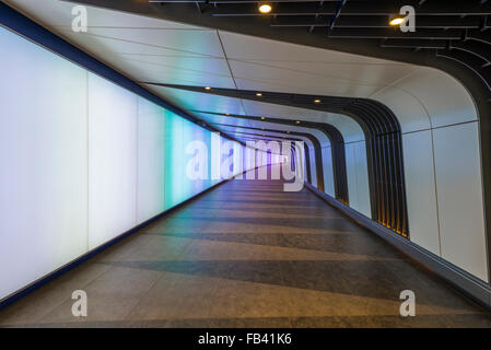 A pedestrian tunnel features an LED integrated lightwall and links St Pancras International and King's Cross St Pancras stations Stock Photo