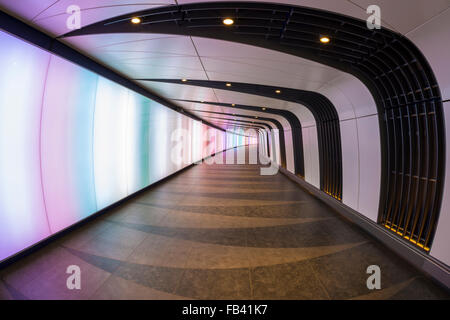 A pedestrian tunnel features an LED integrated lightwall and links St Pancras International and King's Cross St Pancras stations Stock Photo