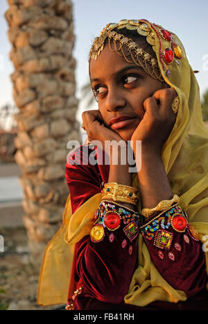 Young girl in traditional costume, Oman Stock Photo