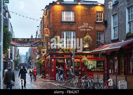 DUBLIN, IRELAND - JANUARY 05: Street in Temple Bar during rainy evening. The area is the heart of tourism in the city. January 0 Stock Photo