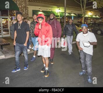 Tyrin Turner & Son, Singer / Rapper 'Lil Caine The Artist' Seen Leaving Dinner with Social Media Star A Town & Friends    Tyrin Turner & Lil Caine both are Starring in Snoop Dogg's Musical Film 'G7'    The group is seen leaving Dinner at BJ's in Thousand Stock Photo